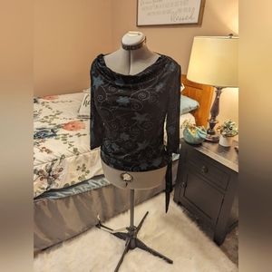 Back and Blue floral blouse with side tie at hem size S